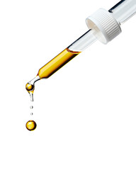 Yellow essential serum oil dripping from gold dropper isolated on white background. Clipping path.