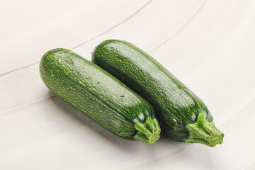 Raw green ripe zucchini vegetable