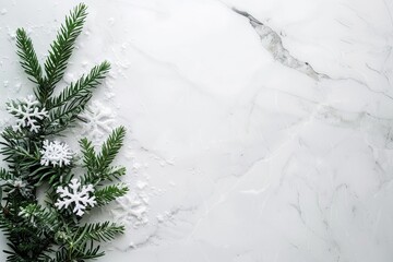 Sticker - A modern winter composition with an evergreen bough and snowflakes on a sleek marble background.