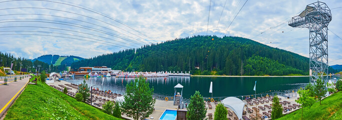 Poster - Panorama of Molodist Lake with modern tourism infrastructure, Bukovel, Ukraine