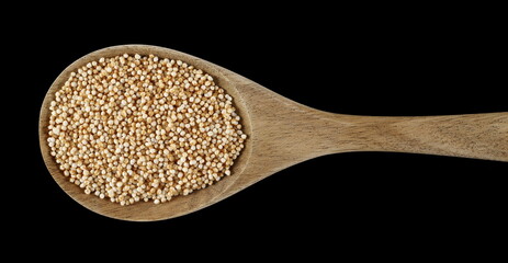 Wall Mural - Amaranth pops in wooden spoon, popped grains isolated on black background, top view