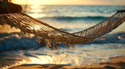 Poster - a hammock hanging over the beach at sunset