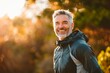 © STOCK IMAGES STALL - Man on his 50s enjoying outdoors activity, shallow focus, hiking sport, smiling sports man, self-improvement, copy space