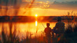 © MikeLegend - Father and son fishing on a lake at sunset