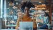 © rookielion - Woman in a stylish office setting, interacting with her laptop, while digital cloud icons and data lines float around her
