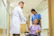 © Art_Photo - Man doctor with stethoscope service help support discussing and consulting care talk to sick senior asian woman patient in hospital,caregiver,elderly,recovery,illness insurance.healthcare and medicine