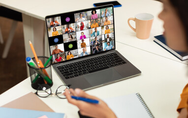 Aufkleber - A laptop screen displays a video conference call with multiple participants of various backgrounds and ethnicities, all appearing in separate video squares.