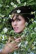 © Volodymyr - Summer beauty. Beautiful woman in a field of daisies. Sensual Woman in a field of summer flowers. Outdoor portrait of girl with a daisies. Summer tender female face. Summer daisy.