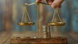 © Sirathee - A hand adjusting a balance scale with coins on one side and expenses on the other, representing financial balance and planning