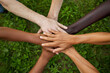 © Jhon - All hands together, united diversity or multi-cultural partnership in a group. Concept of teamwork, collaboration, and cooperation in a diverse community.