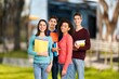 © BillionPhotos.com - Happy young students Holding notepads