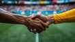 © Sorat - Two athletes shaking hands in a stadium, symbolizing sportsmanship and mutual respect after a game. Blurred crowd in the background.