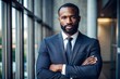 © N7 - Black Man in Business Suit with Arms Crossed