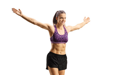 Wall Mural - Fit young woman running and spreading arms wide open