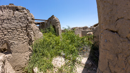 photography of old abandoned adobe village near nizwah in oman during spring day