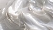 © Ailee Tian - A close up of white toothpaste or cream texture.