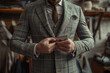 © ValNik Creations - A tailor is working on an elegant business or wedding suit. A custom-made men's suit in a stylish luxury designer tailoring studio. Fashion concept. place for text.