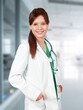 © BillionPhotos.com - Happy confident doctor woman in medical office