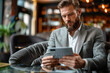 © Outsiderzone - Stylish businessman shopping online with credit card on digital tablet: Modern e-commerce concept.