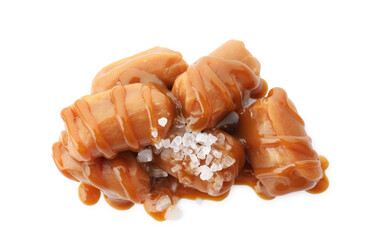 Poster - Yummy candies with caramel sauce and sea salt isolated on white, top view