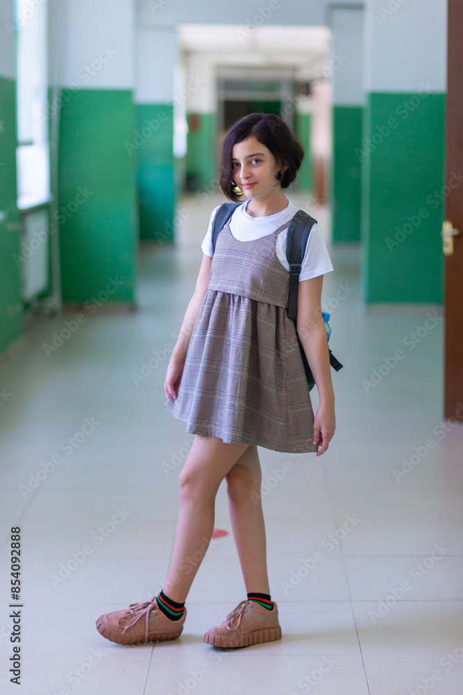 Beautiful girl in a school corridor posing for the camera Stock Photo ...
