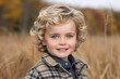 © Ben - Smiling blond boy with blue eyes in an autumn field, capturing the joy and innocence of childhood in a natural outdoor setting, Generative AI