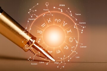 Wall Mural - pen and astrology book. wheel projection with zodiac sign.