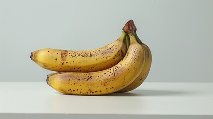 Wall Mural - Fresh bananas on white table background focusing closely