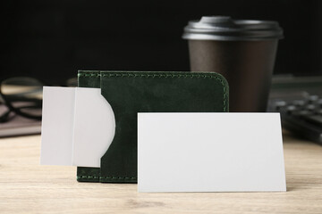 Wall Mural - Leather business card holder with blank cards on wooden table