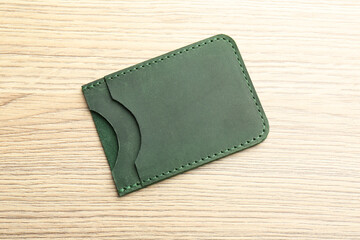 Wall Mural - Leather business card holder on wooden table, top view