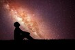 © STOCK PHOTO 4 U - Silhouette of Person Sitting and Gazing at the Milky Way Galaxy in a Starry Night Sky