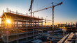 © Artistic Visions - construction site for a large building with a clear blue sky background
