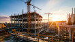 © Artistic Visions - construction site for a large building with a clear blue sky background