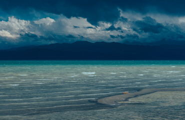 Sticker - Issky-kul lake in Kyrgyzstan, summer picturesque stormy landscape