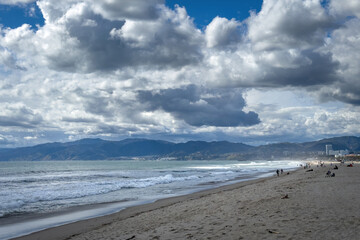 Wall Mural - Scenic view of Venice Beach, Los Angeles, California, USA against Santa Monica mountains and blue sky with clouds