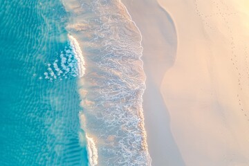 Wall Mural - Turquoise water meeting golden sand on a tropical beach aerial view