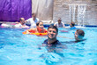 © Viga - Portrait for males having fun and cheerful smile at the pool during there trip on summer
