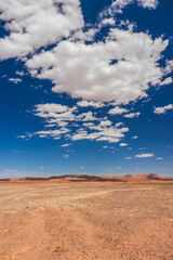 desert mesa landscape with afternoon clouds