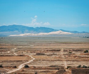 Wall Mural - Dagestan, Sarykum sand dune on the horizon