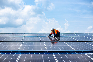 engineer service check installation solar cell on the roof of factory , sustainable energy industry 