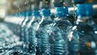 © Photolife   - bottled drinking water production line. packaging and production of drinking water in plastic bottles on an assembly line at a factory