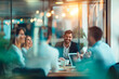 © ty - Blurred happy business people in an office engage in a lively, brainstorming meeting, discussing project management for their company