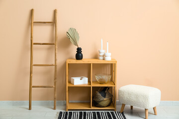 Poster - Vase with dried palm leaf, dresser and ladder near beige wall