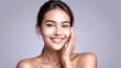 © Art - Woman smiling while touching her flawless glowy skin with copy space for your advertisement, skincare