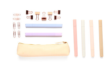 Wall Mural - Beige pencil case and different school stationery on white background