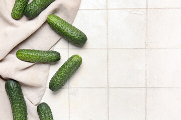 Wall Mural - Fresh cucumbers on white tile background