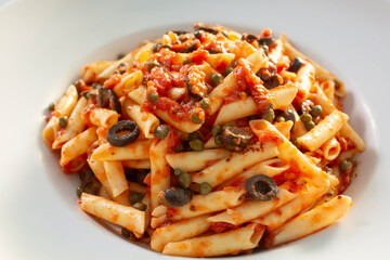 A view of a bowl of penne all’Arrabbiata.