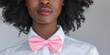 © Valeriia - Gender sexual equality human rights concept. African American woman with pretty lips and pink tie bow banner poster for adverticement.