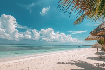 Wall Mural - Panorama beautiful beach with white sand, turquoise ocean and blue sky with clouds on Sunny day. Summer tropical landscape with green palm trees and Straw umbrellas with empty copy space