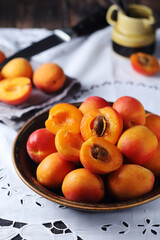 Wall Mural - Fresh ripe apricots in bowl in rustic style